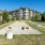 Gravel cornhole area with stool