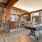 Large room with shuffleboard table and bar area