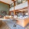 Large room with leather couches and a green wall